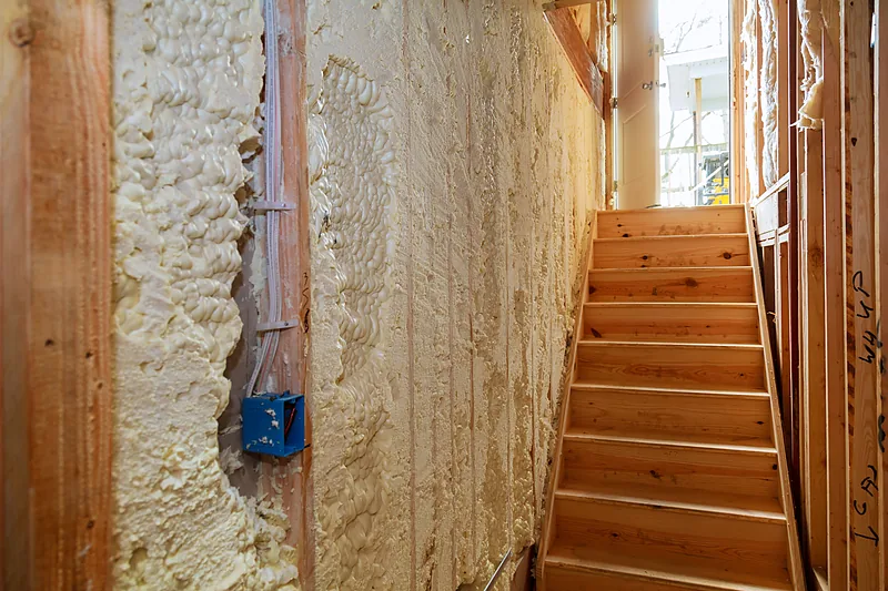 Foam insulation in a framed wall assembly
