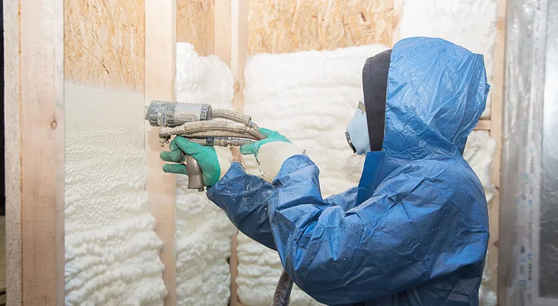 Insulation contractor spraying foam